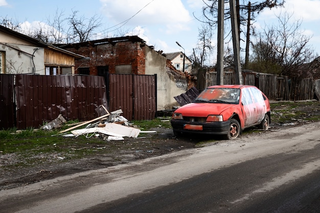Free photo broken red car russian's war in ukraine
